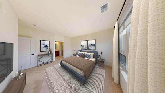 A bedroom with a large bed and a television.