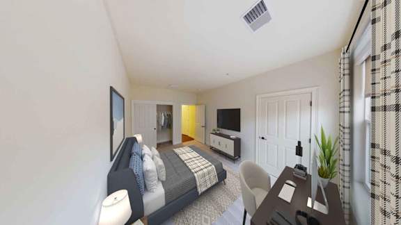 A bedroom with a bed, chair, and television.