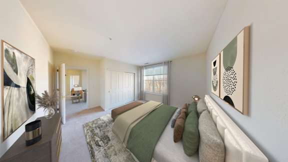 A bedroom with a bed, a dresser, and two framed pictures on the wall.