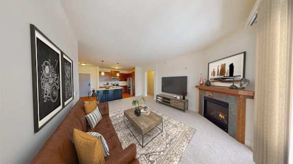 A living room with a fireplace and a television.