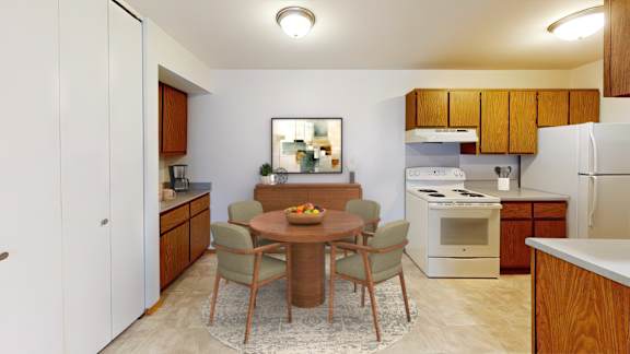 A kitchen with a table and chairs in the middle of the room.