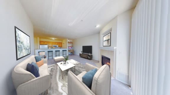 a living room with a couch and a fireplace