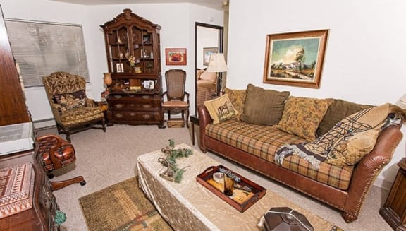 a living room with a couch and a table
