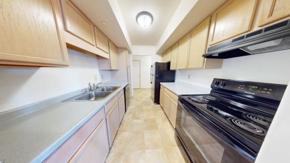 a kitchen with a stove and a sink