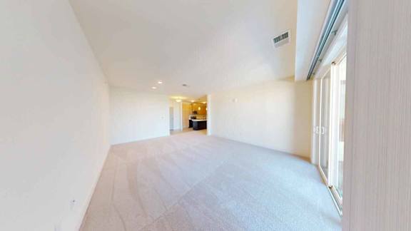 A long, empty hallway with a light at the end.