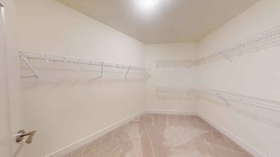 A room with white walls and a marble floor.