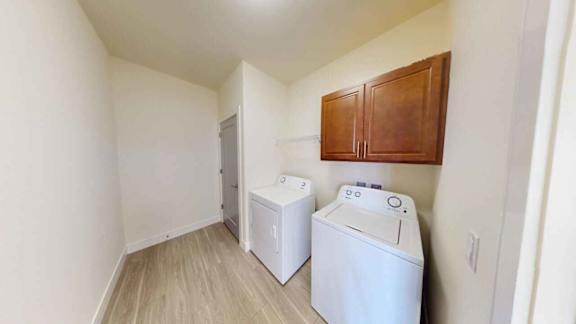 A small room with a washer and dryer.
