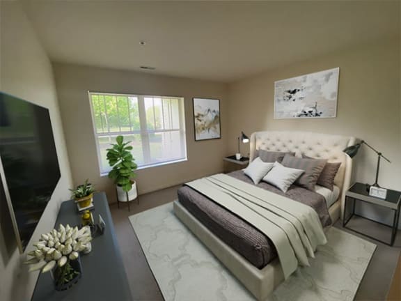 a bedroom with a bed and a tv