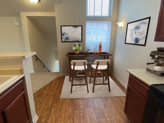 a dining room with a table and chairs