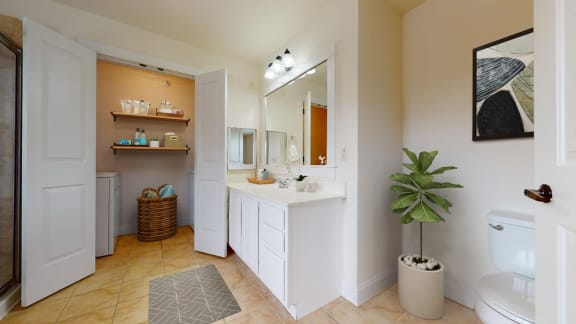 a bathroom with a sink and a toilet and a mirror