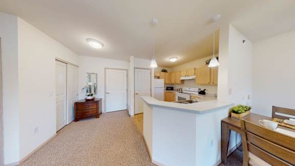 A kitchen with a counter and a sink.