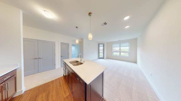 A kitchen with a sink and a countertop.