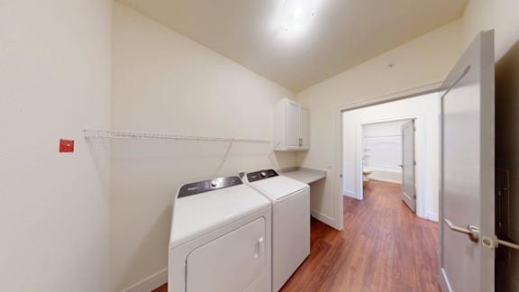 A laundry room with a washer and dryer.