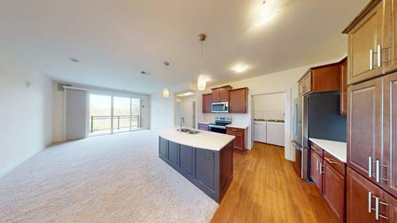 A kitchen with wooden cabinets and a white countertop.