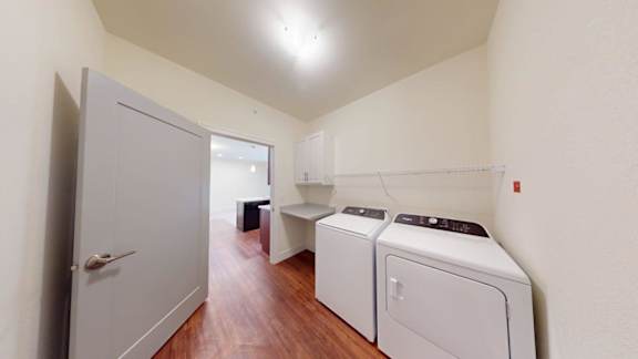 A laundry room with a washer and dryer.