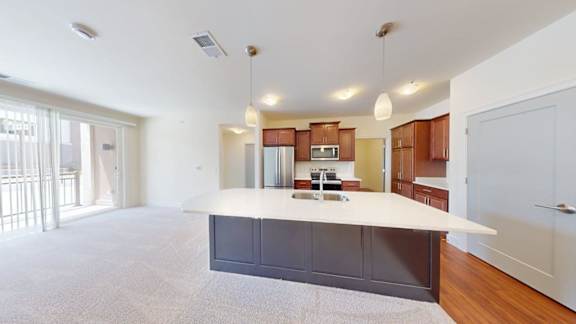 A spacious kitchen with a large island in the middle.
