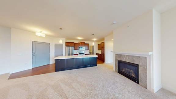 A living room with a fireplace and a couch.