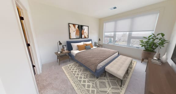 a bedroom with a bed and a large window