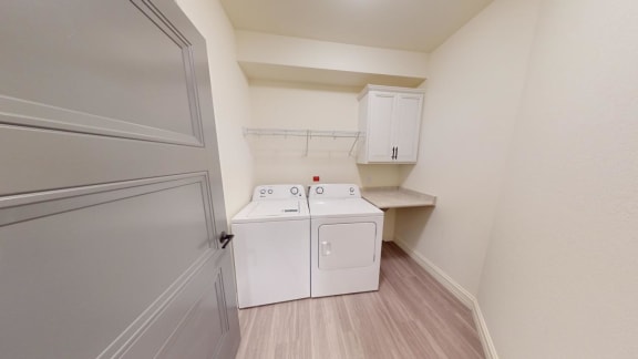 a laundry room with a washer and dryer in it