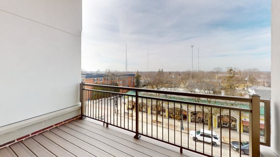 a balcony with a view of a parking lot