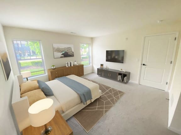 a bedroom with a bed and a tv in it
