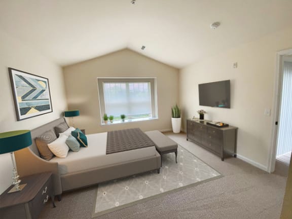 a bedroom with a large bed and a television