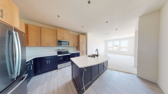 a kitchen with an island in the middle of it