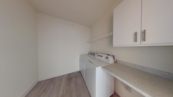a laundry room with a washer and dryer in it