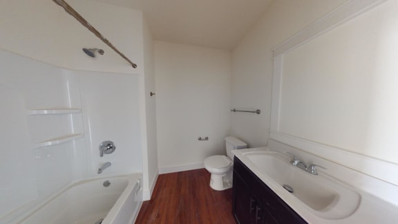 a bathroom with a sink toilet and a bath tub