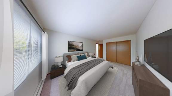 A bedroom with a bed, nightstand, and a window with blinds.