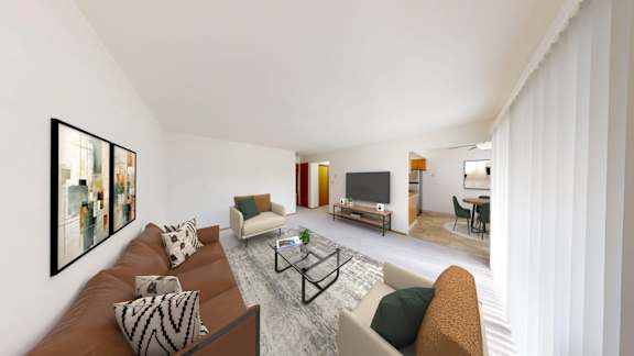 A living room with a brown couch and a coffee table.