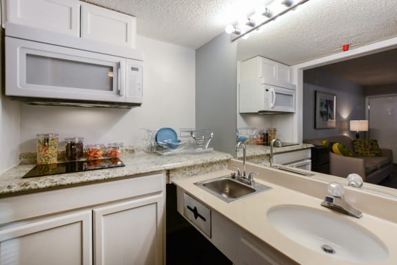 studio kitchen from bathroom at Plato's Cave Apartments Branson, MO 65616