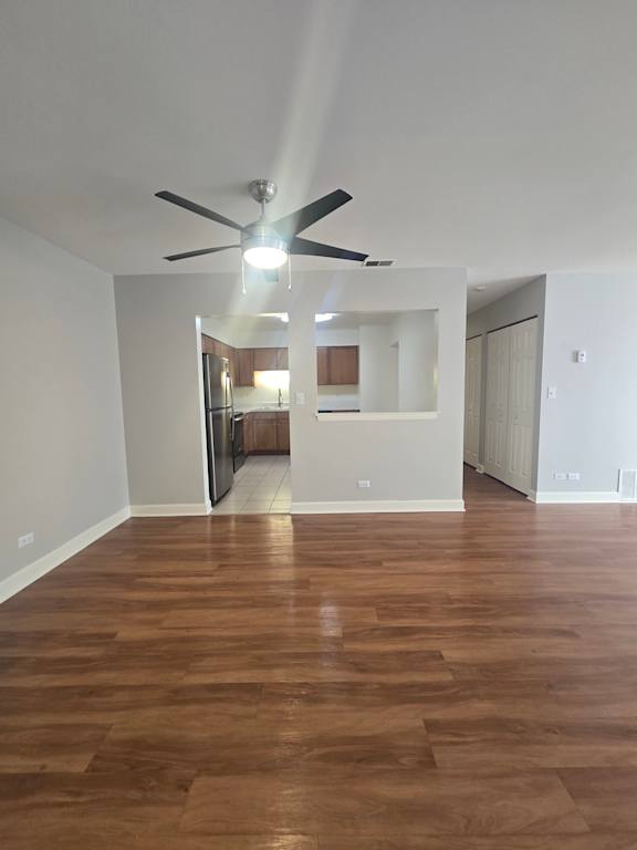 A room with a white ceiling and a wood panelled wall.