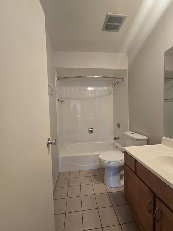 A bathroom with a shower and a toilet.