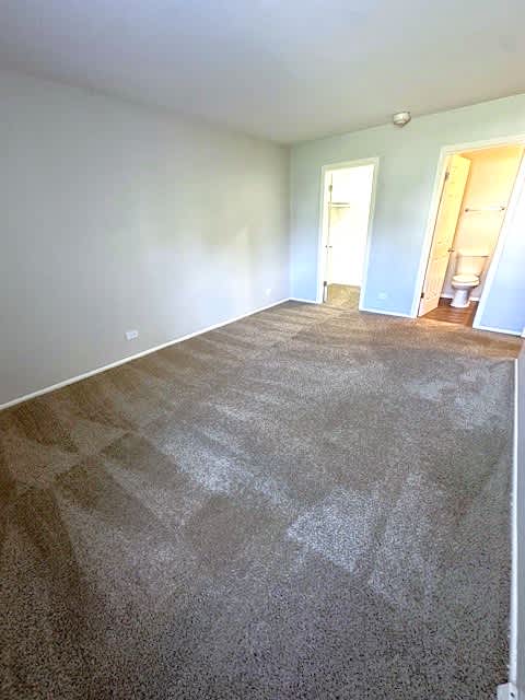 Master Bedroom With En Suite Bathroom And Walk-In Closet