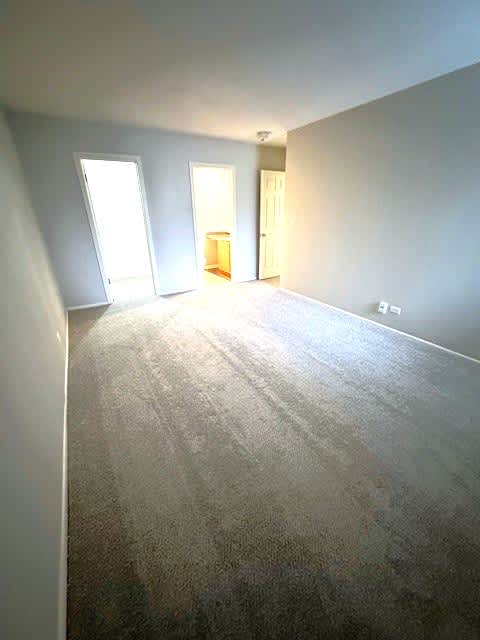 Master Bedroom With En Suite Bathroom And Walk-In Closet