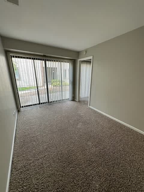 an empty room with a large window