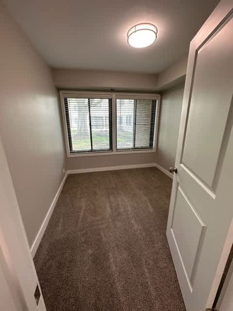 an empty room with a large window