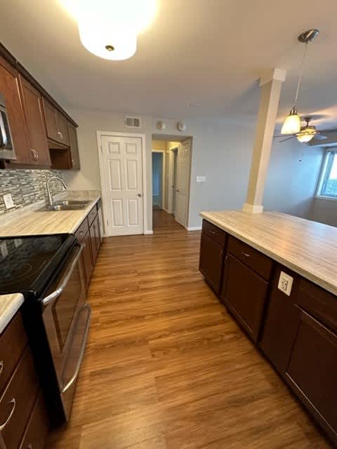 a kitchen with a stove and a counter top