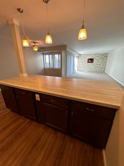 a kitchen with a counter top and some lights