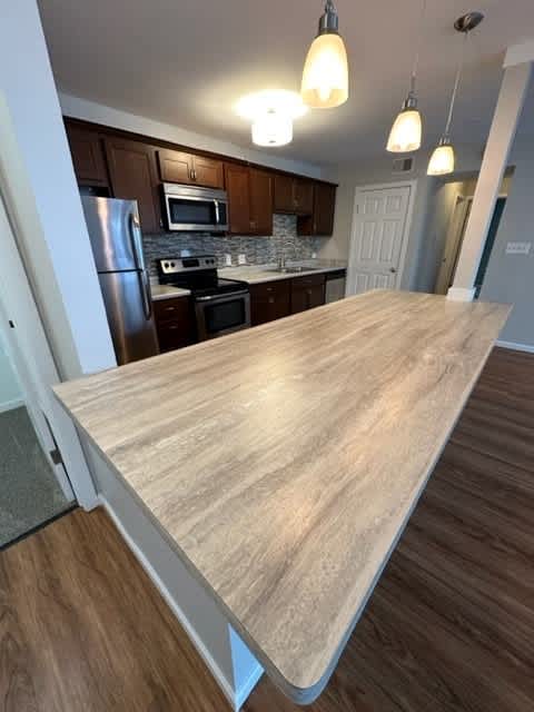 a kitchen with a counter top and a