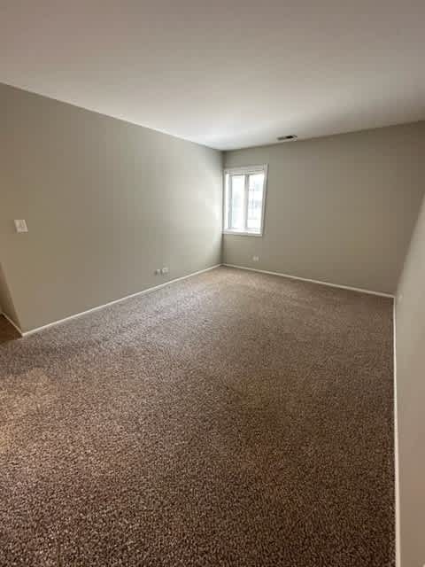 a large empty room with a window