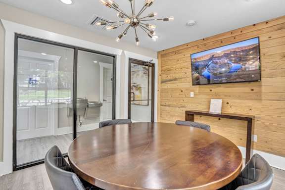 a conference room with a large table and a tv on the wall at Sunset Ridge, San Antonio, 78209