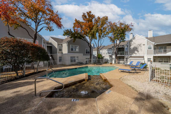 the preserve at ballantyne commons pool and spa with apartment buildings
