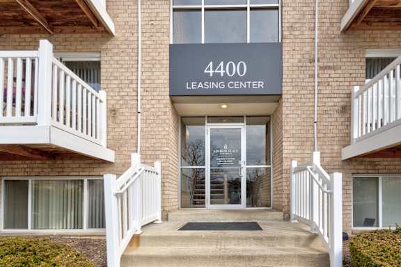 The entrance to a building with the number 4400 and the words "Leasing Center" on the sign.