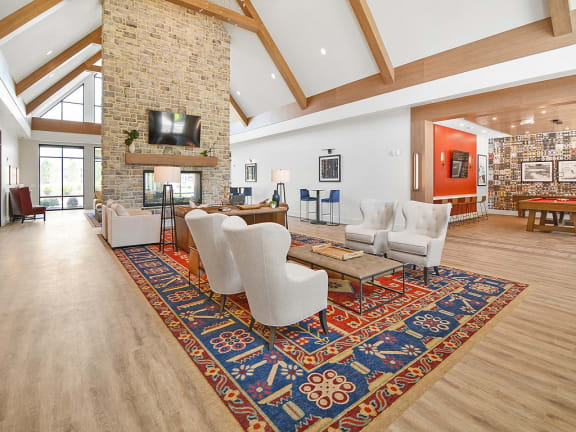 a spacious living room with a fireplace and a rug