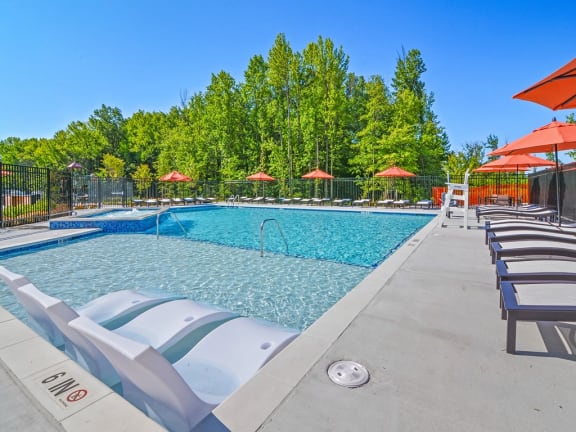the reserve at city center spacious pool with chairs and umbrellas