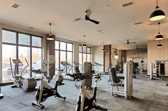 A gym with a variety of exercise equipment.