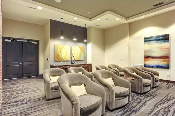 A row of chairs are lined up in a room.
