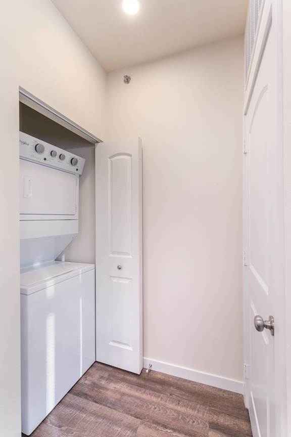 A small laundry room with a washer and dryer.